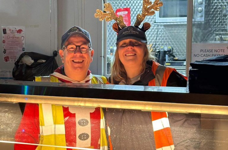 Staff members running a bbq at Christmas