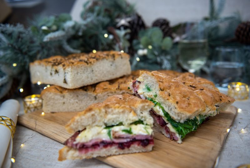 Baked Focaccia, Ham, Camembert, Cranberry, and Rocket Sandwich